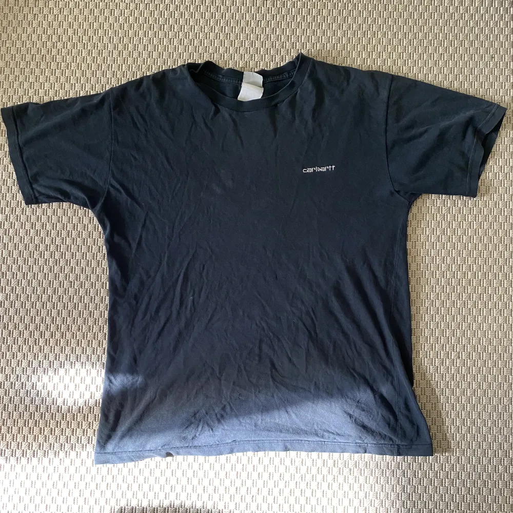 Vintage svart T-shirt från Carhatt i storlek L. Använt skick . T-shirts.