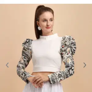 White crop fitted top. S- M, floral print on the arms. High neck, bishop sleeves,woven . Unused