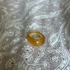 En gul/orange ring från bik bok som aldrig är använd!