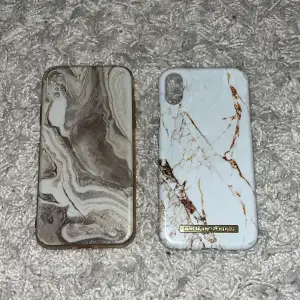 Mobilskal i marmor för iPhone xr, högra från ideal of sweden och vänstra från shein. Andra sidan ser man en liten spricka i det vita skalet 