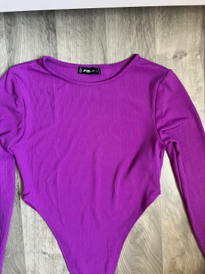 Lila body - En helt oanvänd body som är köpt från New yorker