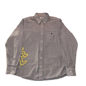 Bape x Keith Haring Oxford BD shirt - Cond 9/10. Retail price 3600 sek. Bid 1500.