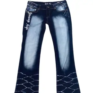 Angel Age Lowrise Flare Jeans: Stretchy comfort zip detail on back pocket 
