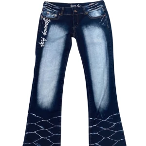 Angelic Flair Lowrise by Angel Age - Angel Age Lowrise Flare Jeans: Stretchy comfort zip detail on back pocket "Angel Age" in rhinestones on the front style meets flair effortlessly