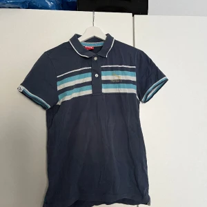 Blå vintage piké från puma  - Snygg Blå piké från puma