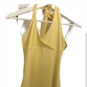Yellow halter neck maxi dress - Only worn once. Super pretty yellow color. Size M/38  Perfect for a girls night or dinner.