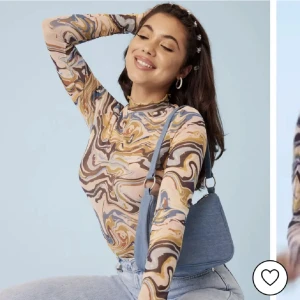 Melerad meshtopp - Långärmad topp från Nelly i mesh 