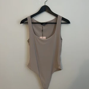 Ljusbeige bodysuit - Ljusbeige