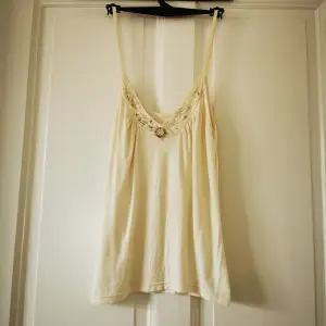 Sleeveless t-shirt size S. Hand embroidery. Super nice fit and excellent quality. Worn only once