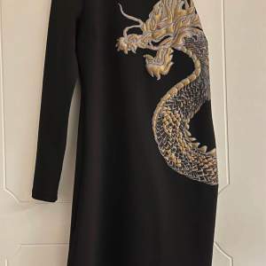 Brand new offshoulder black dress with golden dragon. Bought in Spain for 149 EUR