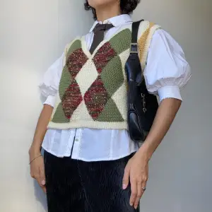 • HANDMADE CROCHET DIAMOND PATTERN KNITTED VEST IN CREAM WHITE, GREEN, YELLOW AND RED  • SIZE - No size / Fits XS-M • BRAND -  Herbishness • MATERIAL - wool