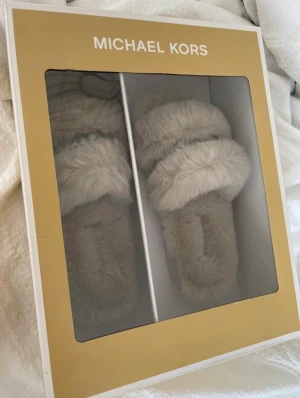 Original Michael Kors slippers  - Size 36. Completely new inside the box. Never opened 