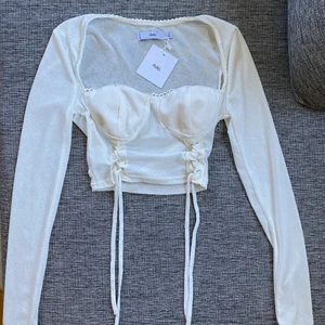 Adika top XS - Aldrig använd top från Adika pga den var för liten för mig! Tagen sitter fortfarande kvar! 
