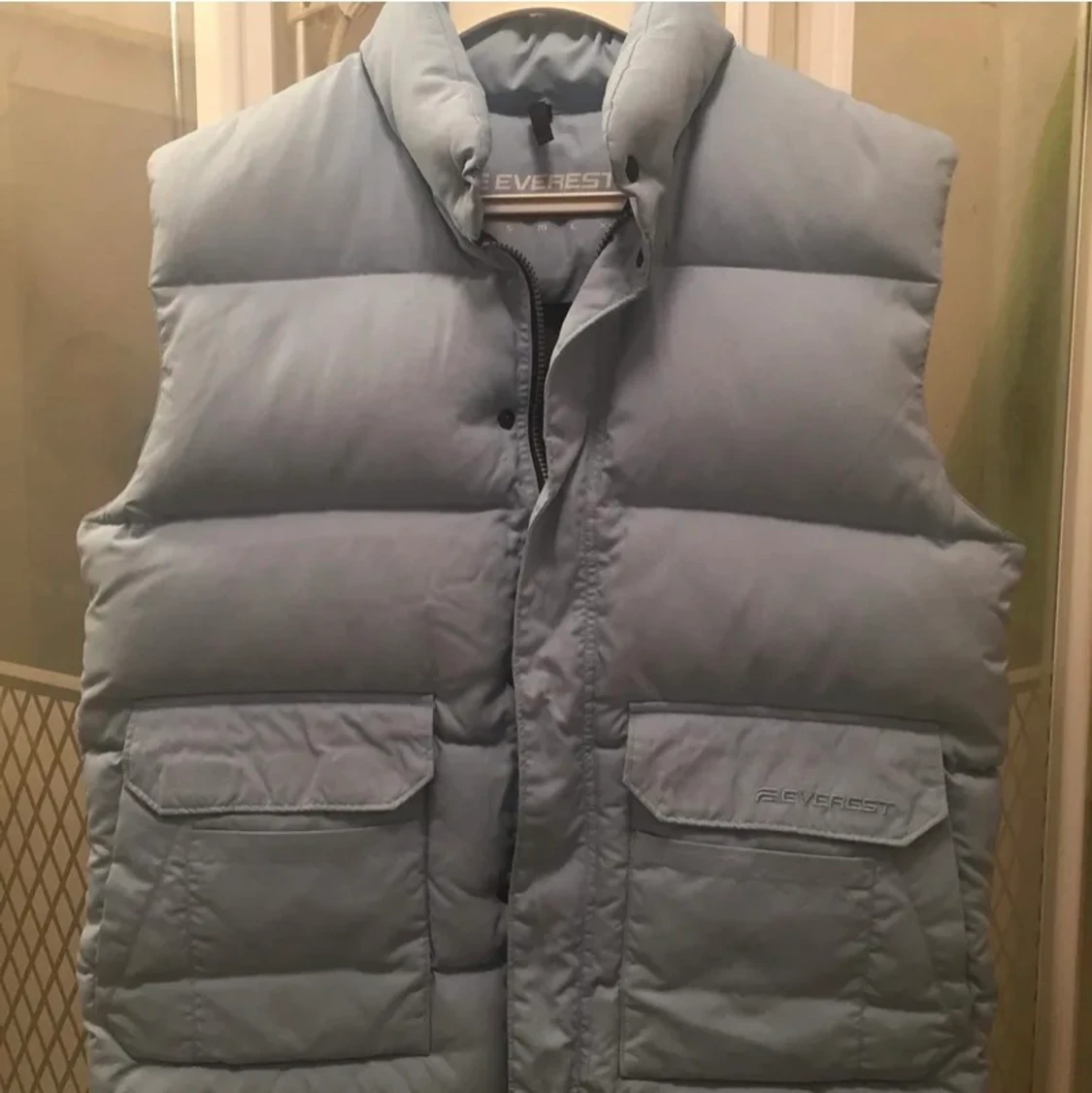 Ljusblå dunväst  - 91