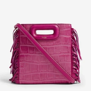 Maje väska - Hej!! Säljer min coola maje väska som är knappt andvänd, i en super härlig rosa färg så fin till sommaren💓💓💓små slitningar på baksidan men det syns knappt