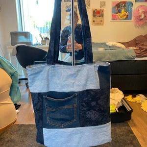 Tote bag - Selling a hand sewed tote bag, made out of denims. The bag is super large and cool, and is so handy for picnics or trips…anything where you need a bigger bag. It has a small pocket in the front to fit a phone and a few small things. 