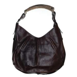Äkta Yves saint Laurent väska i mörkbrunt skinn i bra skick! Säljer då den tyvärr inte längre kommer till användning…. Bredd: 36cm Höjd: 50cm