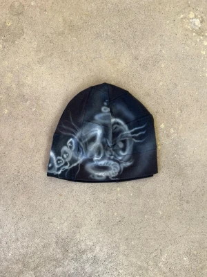 Airbrushed patchwork beanie - Sewn by us from old fabric scraps and airbrushed by Shamo