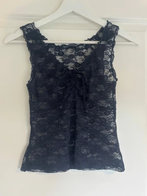 Brandy Melville Lace top - En Lace top från Brandy Melville. Helt oanvänd. 