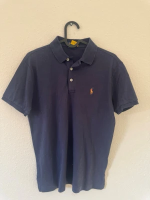 Mörkblå pikétröja Ralph Lauren - Storlek S