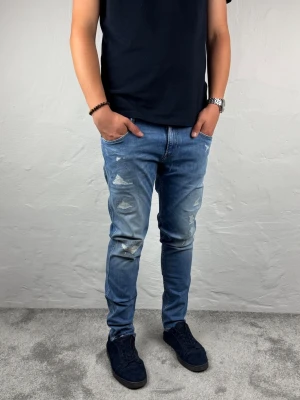 Replay jeans  - Ett par riktigt snygga jeans från Replay i storlek W32 L32 i modellen Anbbas  