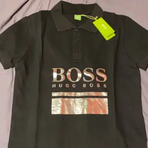 Hugo boss piké säljs