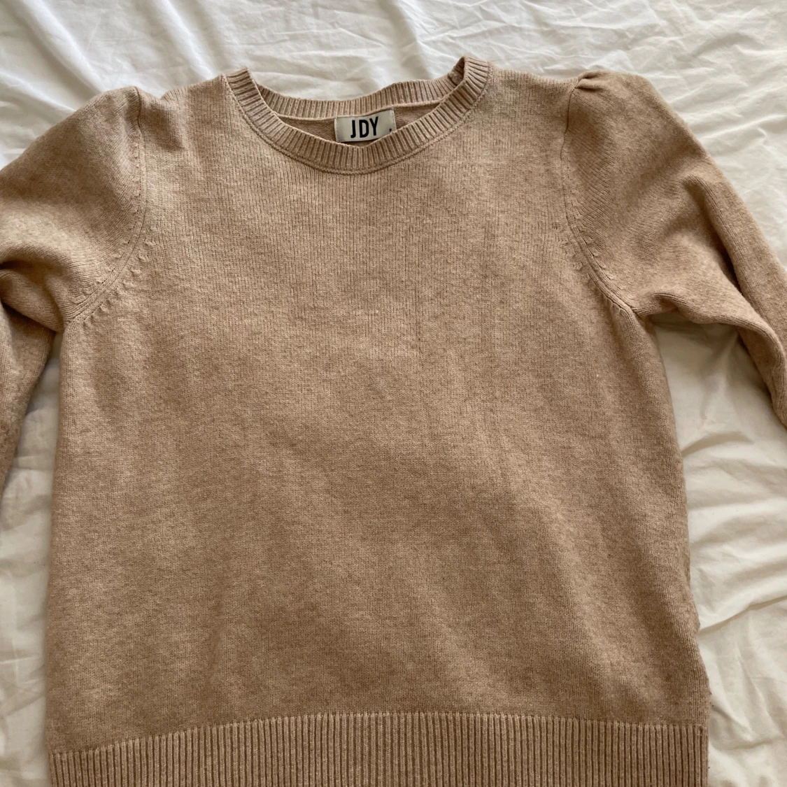 beige stickad tröja