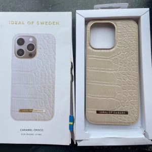 Mobilskal - Ideal of sweden till iPhone 13. Skriv vid frågor