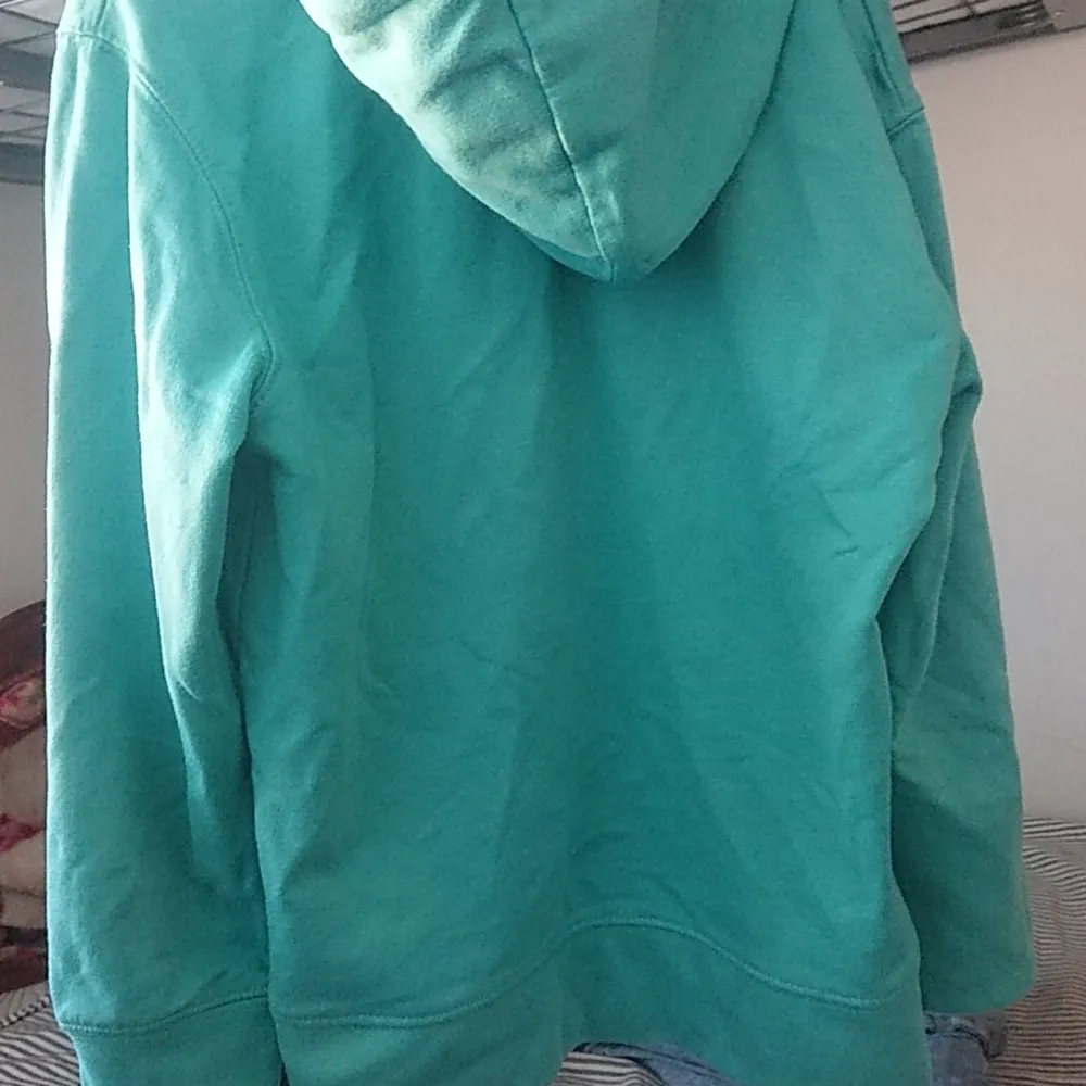 It is a turwoise and green mixed hoodie for 8 to 9 year old boys. It is used but not that much. Prices can be lower if interested. Hoodies.