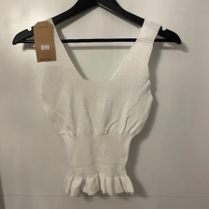 Topp - Inte använd Skön i materialet 