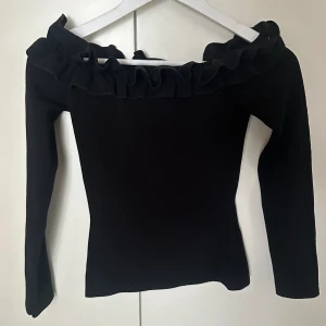 Axellös tröja  - Svart Axellös tröja 