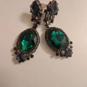Blue/green/ black earrings. Never used. Come with a pouch.