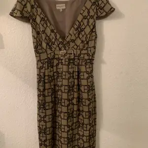 Silk dress,  beige and black geometric pattern. Size Eu38/S (sizing is small, really a size Eu 36). New. Never worn. Lined. Buckle at waist. 