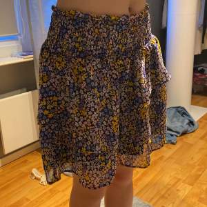 A short shirt with flower patterns on it, only used a couple times good condition 