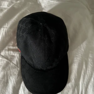 Gucci keps - Svart Gucci keps Storlek L Kan bevisa att den är äkta 