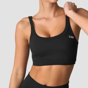 Svart sport-bh från ICANIWILL nimble - Säljer en svart sport-bh från ICANIWILL med breda axelband och rundad urringning. Bh:n har en stilren design med diskret vit logga på bröstet. Tillverkad i ett stretchigt och mjukt material som passar perfekt till träning.