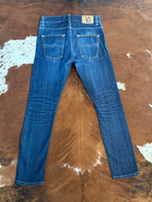 Slim Nudie LeanDean DryDeepSelvage - Tjena! Säljer dessa riktigt feta nudies i modellen LeanDean DryDeepSelvage, fint skick med nice wash, W29/L30, hör av dig vid funderingar!🤩