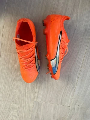 Puma Ultra Ultimate FG/AG  - The shoes are very light and created for speed also has a gripknit that makes your touch better. New price 2499kr.
