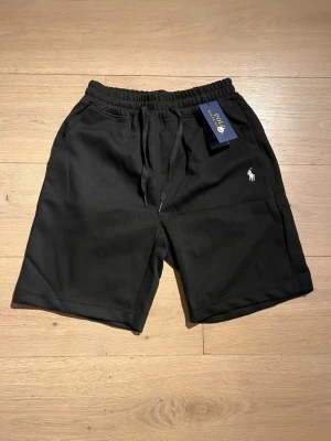 Black RL shorts  - Black Ralph Lauren shorts Size L. More like size M.