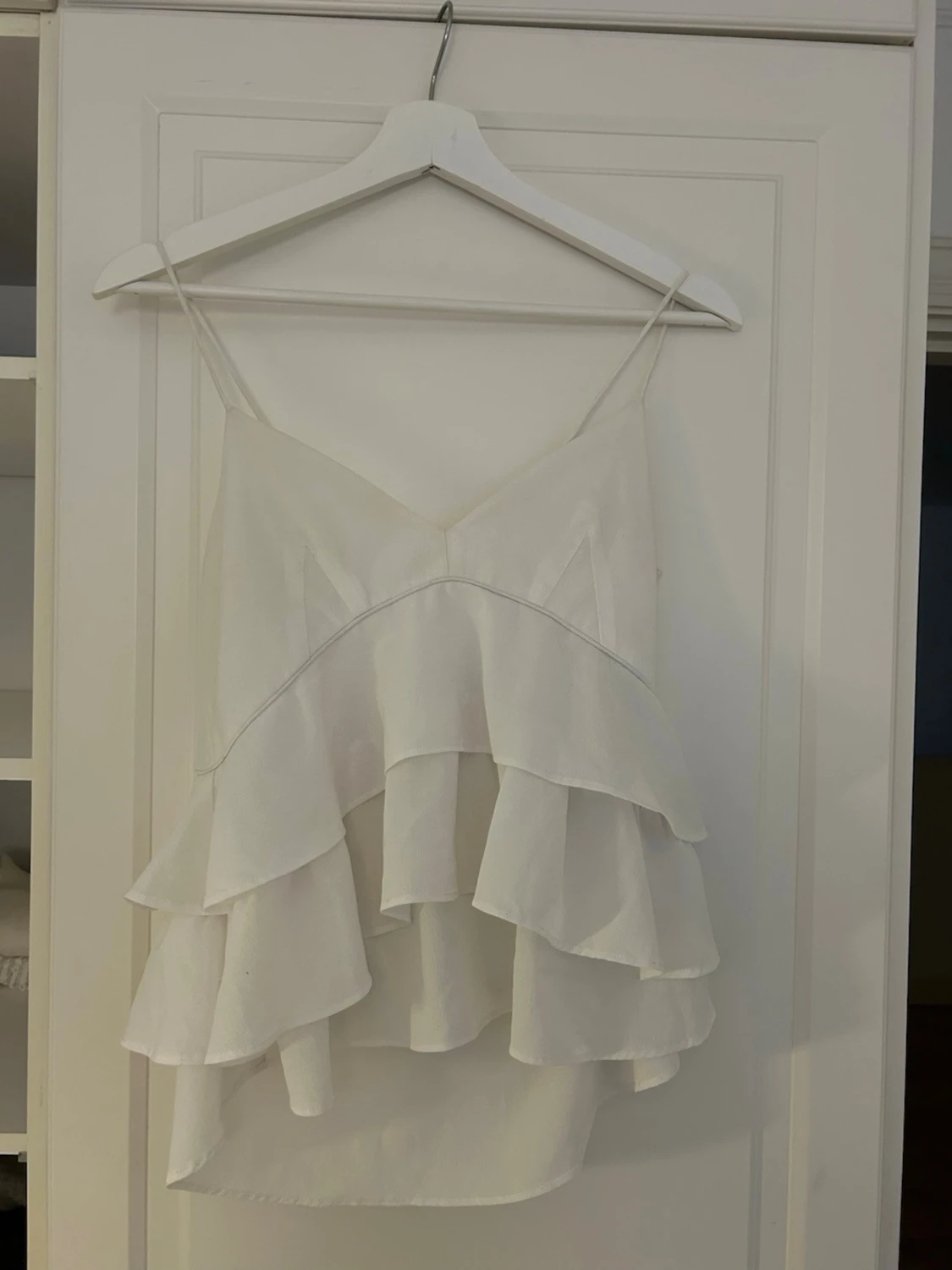 Vit volangig linnetopp