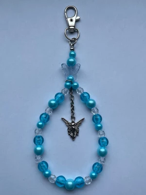 Blå nyckelring/bag charm🩵 - Blå bag charm/nyckelring med berlock, gjord av mig💕