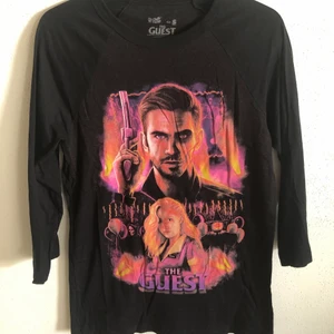 The Guest Movie Retro Baseball Tee - Cavitycolors The Guest Movie Retro Baseball T-Shirt  Size small, regular small fit.  Excellent condition, no flaws or damage.  DM if you need exact size measurements.   Buyer pays for all shipping costs. All items sent with tracking number.   No swaps, no trades, no offers. 
