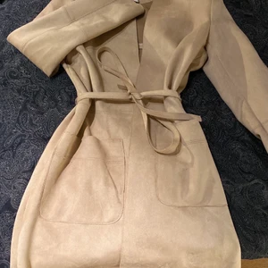 Beige kappa  - Ej så använd  storlek S 