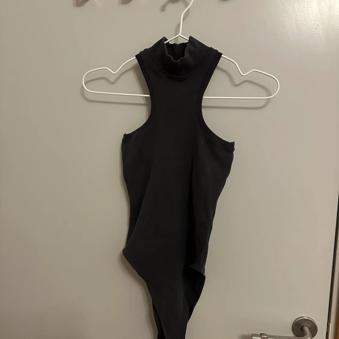 Två polo bodys från Zara.