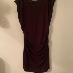 Burgundy dress, above knee, draped at waist, beautiful casual wear. Very comfortable. Very good condition. Worn a few times. 