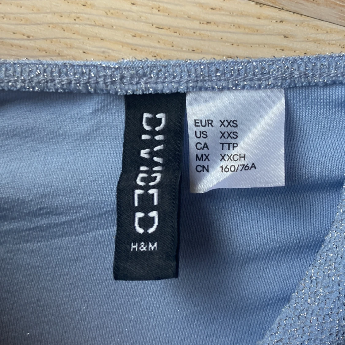 Glittrig blå topp - 90