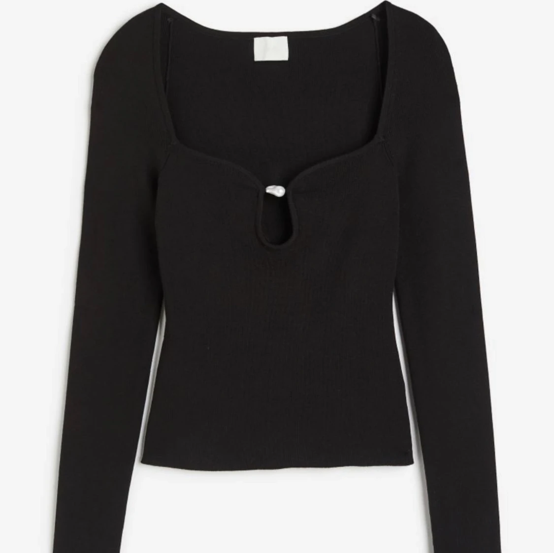 Svart topp med pärla