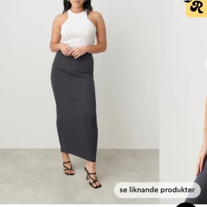 Långkjol  - Säljer min mörkgråa långkjol från gina med detaljer på sidan, aldrig använd. Säljer även matchande topp till