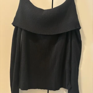 Black long sleeve off-shoulder knit - Only wore one time. Appropriate for all seasons except summer.