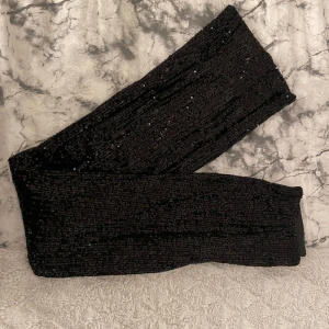 Paljett byxor - Paljett byxor  Använda en gång Utsvängda 